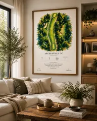 Framed Studio style print above a cream sofa in a bright living room