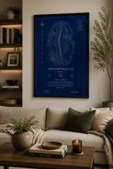 Framed Blueprint style print above a cream sofa