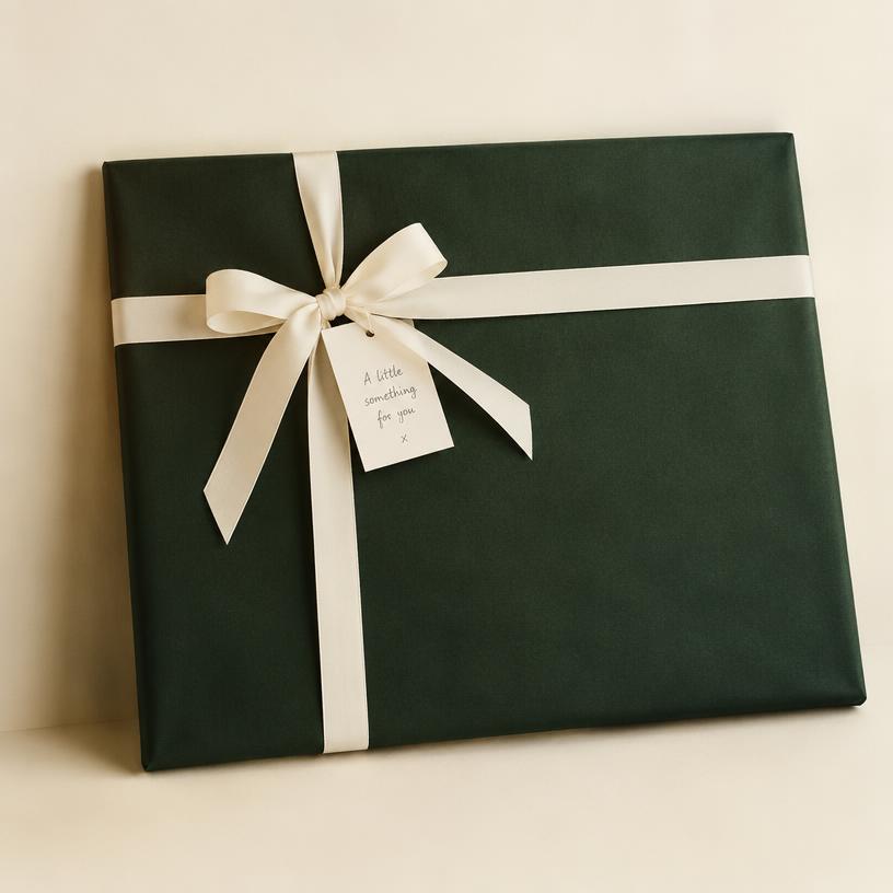 Gift-wrapped framed print with handwritten note